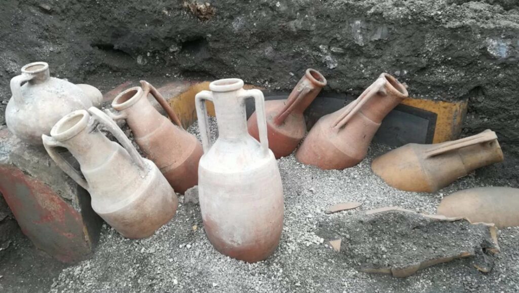 Archaeologists found amphorae, which look just like the ones in the painting, in front of the eatery.