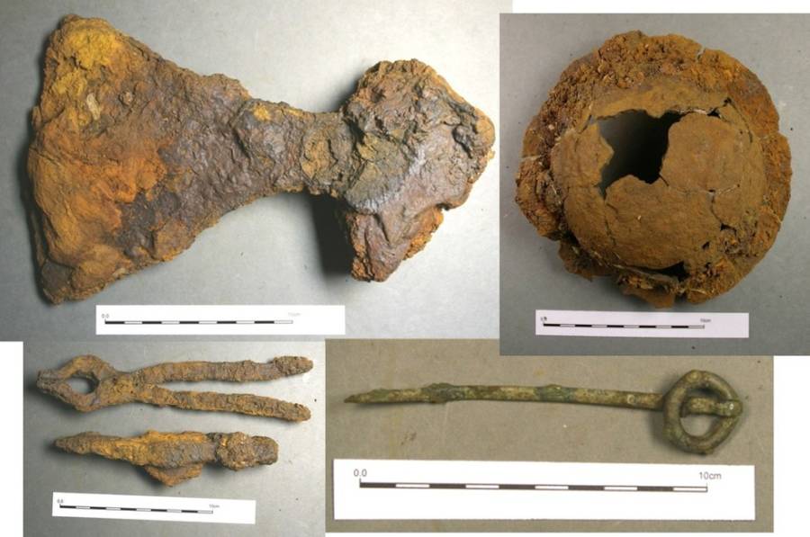 Some finds recovered from the grave (clockwise from the top left): broad-bladed axe, shield boss, ringed pin and hammer and tongs.