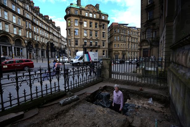 Simon Brooks showing the section of Hadrian's Wall that's been found on Westgate Road outside the Mining Institute (Image: Newcastle Chronicle)