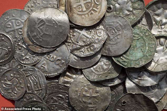 Researchers said that around 100 silver coins from the collection (pictured) are probably from the reign of Bluetooth, who was the king of what is now Denmark, northern Germany, southern Sweden and parts of Norway.