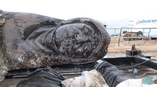 17th-century Dutch merchant ship off southern England have recovered a 30-foot-long wooden carving of a mustachioed warrior