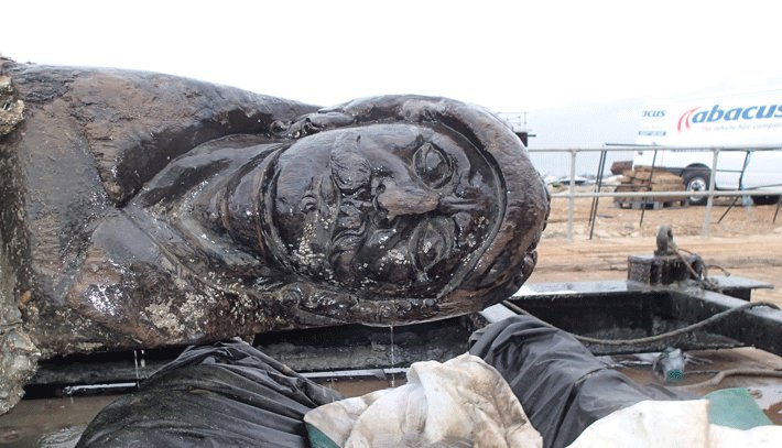 17th-century Dutch merchant ship off southern England have recovered a 30-foot-long wooden carving of a mustachioed warrior