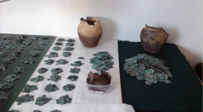 A hidden hoard of more than 6,000 silver coins found in a forest in Poland