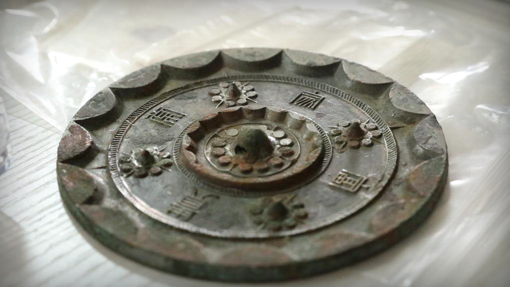 Over 2,000-year-old bronze mirrors unearthed at a cemetery in NW China