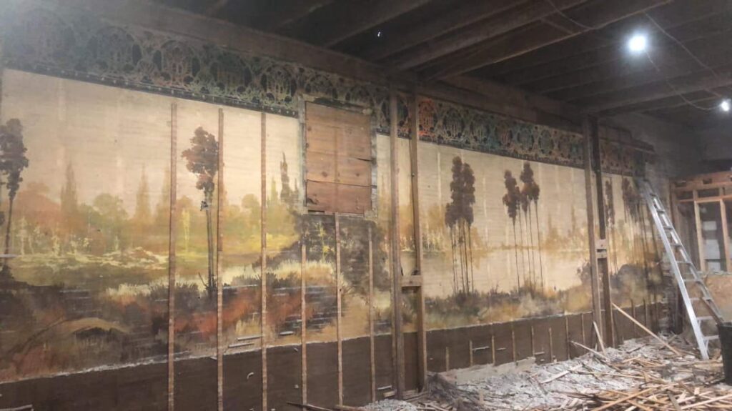 A couple renovating a 115-year-old building discovered two 60-foot-long hidden murals