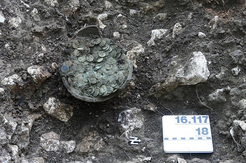 Treasure of 1,290 Ancient Roman Coins Discovered by Amateur Archaeologist in Switzerland