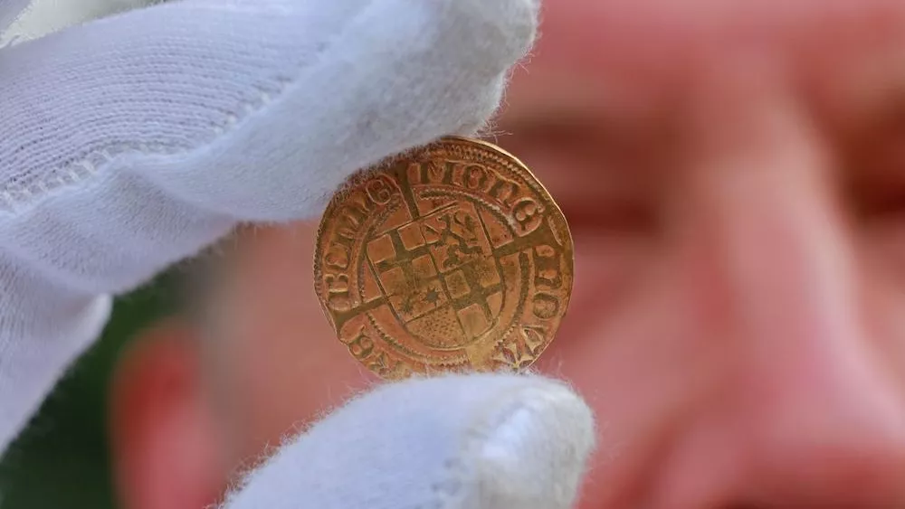500-year-old gold coins discovered in a German monastery were 'hastily hidden' during a 'dangerous situation'