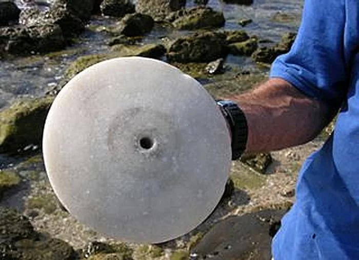 A rare 2,500-year-old marble disc, designed to protect ancient ships and ward off the evil eye discovered near Palmachim Beach