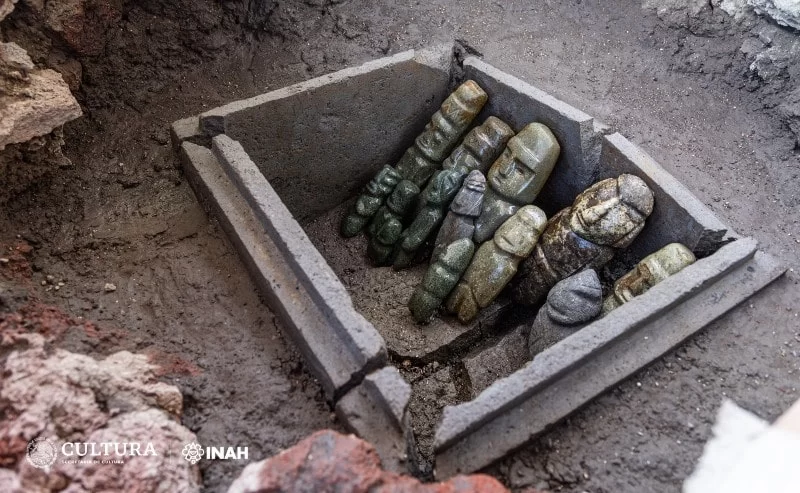 Archaeologists have unearthed a stone chest containing the ritual deposit of 15 anthropomorphic figurines